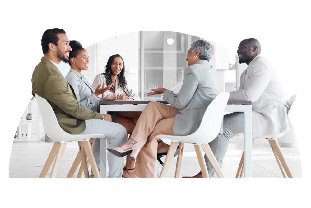 Team Collaboration | CAQA LLND A diverse group of professionals collaborates around a conference table, demonstrating CAQA LLND's commitment to skills.