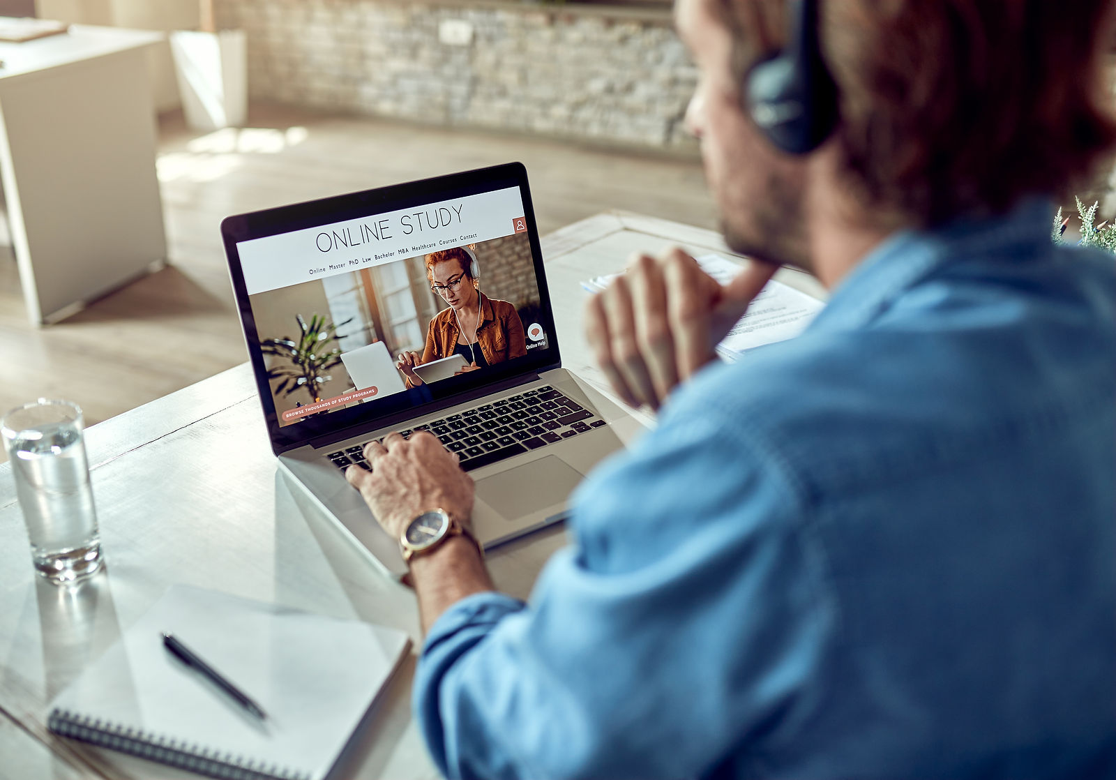 Online Learning | CAQA LLND A person studies online using a laptop and headphones for digital skills development.