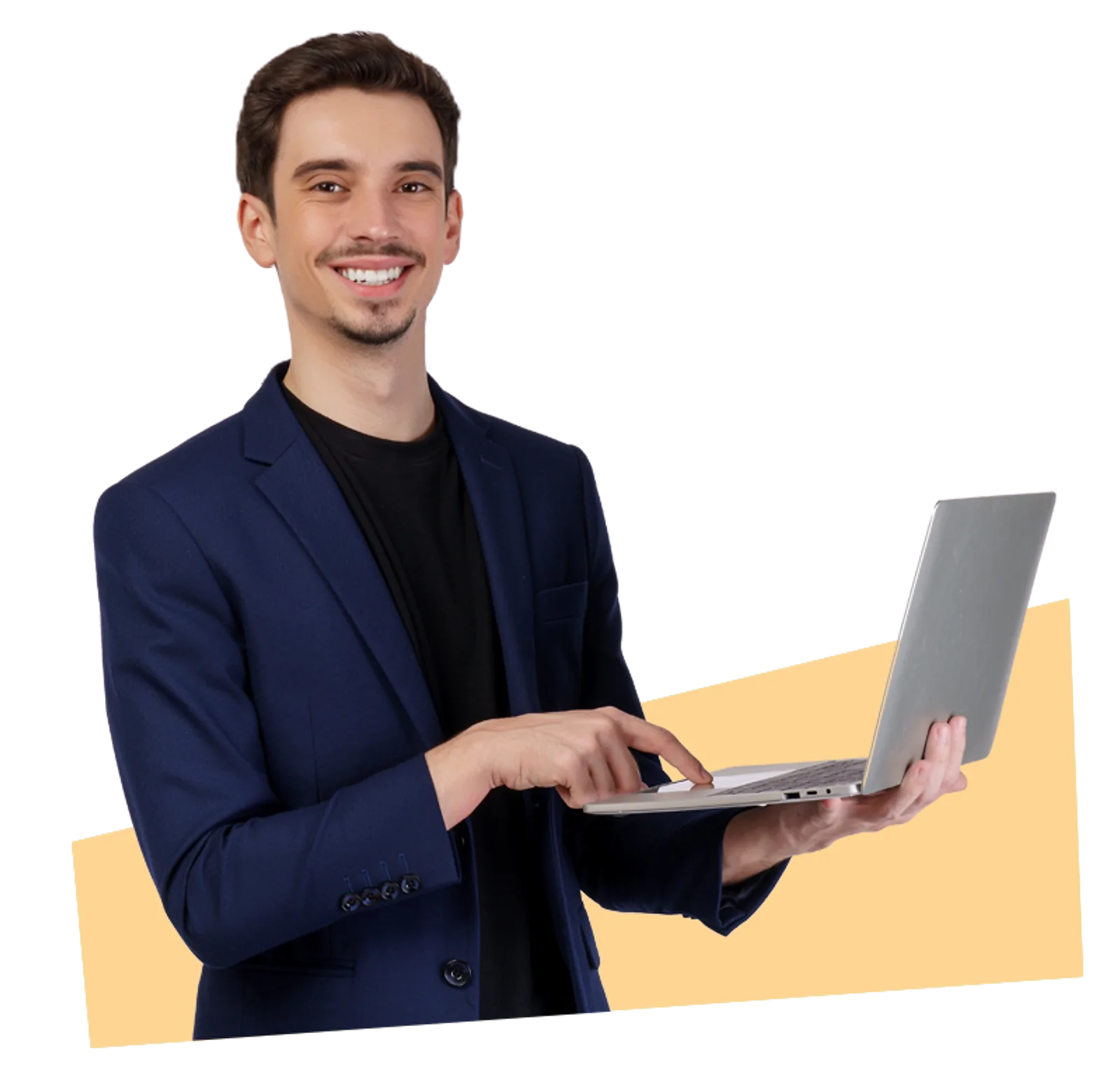 Smiling Trainer | CAQA LLND A smiling man in a suit types on a laptop during an LLND training session.