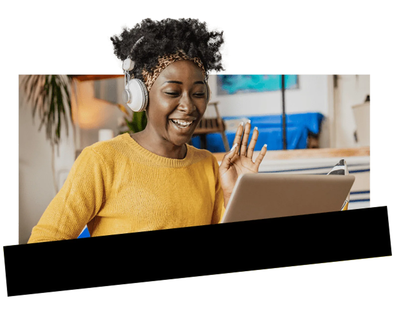 A smiling woman participates in a video call on her laptop, showcasing CAQA LLND’s digital skills training.