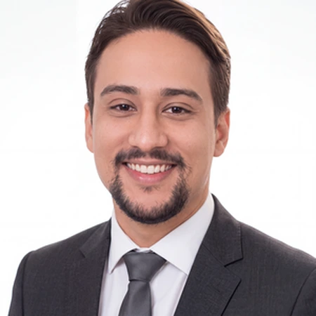 A smiling Abishek Timsina poses for a professional headshot as part of the CAQA LLND team.