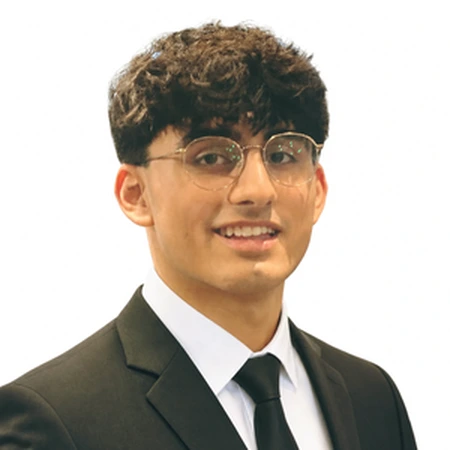 Gurshaan Sandhu smiles for a portrait as part of the CAQA LLND team.
