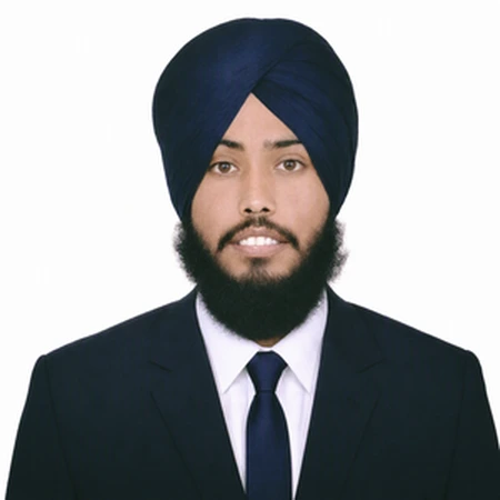 A professional headshot of Heera Moga wearing a dark blue turban and suit, part of the CAQA LLND team.
