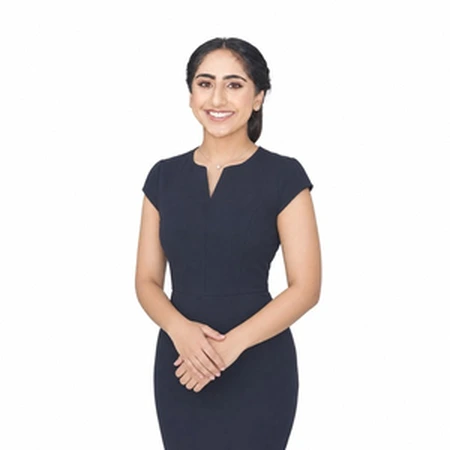 Jissimran Sandhu smiles for a professional portrait, showcasing CAQA LLND's team expertise.