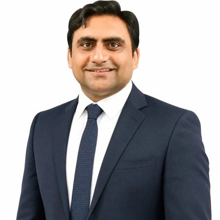 Sukh Sandhu is a business professional smiling for a headshot on the CAQA LLND team.