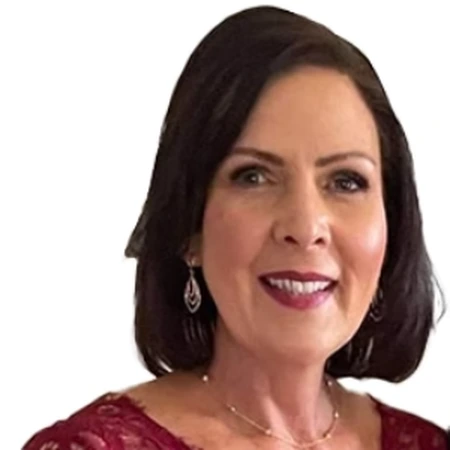 A smiling headshot of Suzanne Martin, a member of the CAQA LLND team.